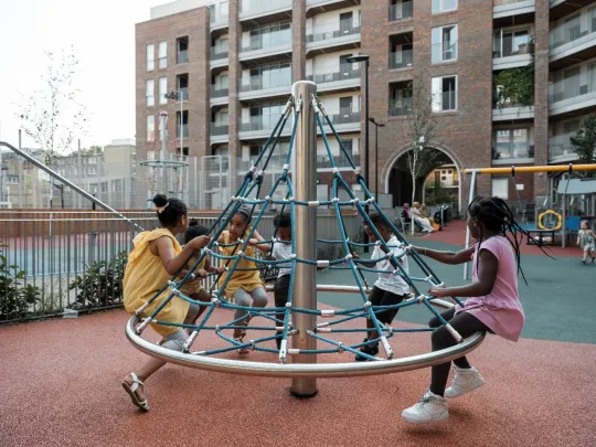 Children playing in the playground on Bourne Estate in Camden