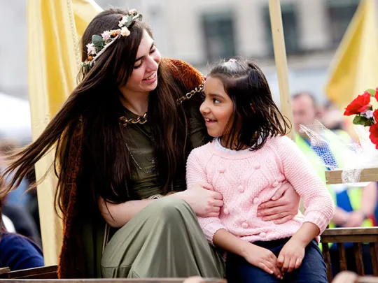Child on a fairground ride
