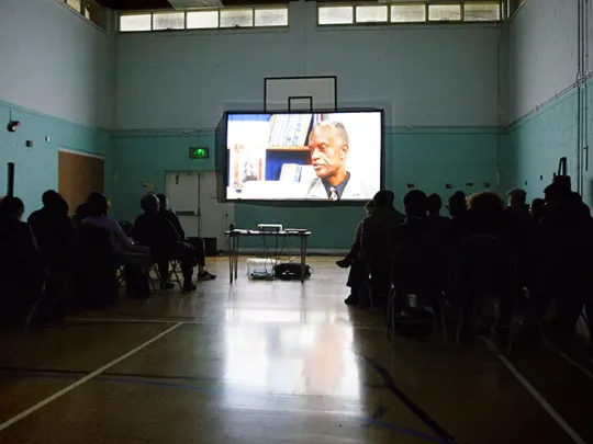 People watching a film credit Rebecca Cresta 