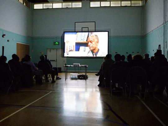 People watching a film credit Rebecca Cresta