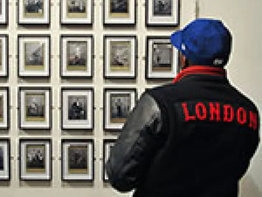 Man looking at photographs