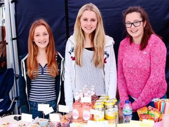 Teenagers selling at the market