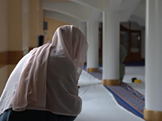 Muslim woman praying in Mosque