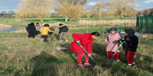 Newton Park environment with kids digging 
