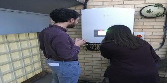 Caversham GP panel programme strategies two people looking at a boiler system outside the building