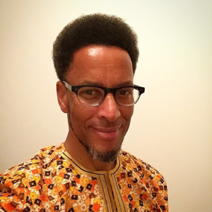 Mugshot of Kenneth face wearing glasses