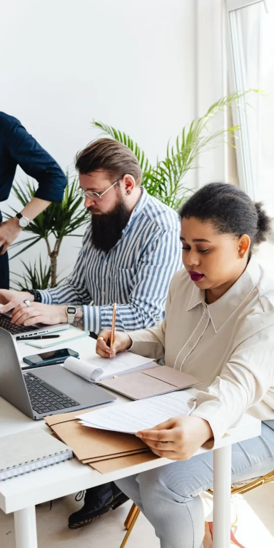 Woman and man working at the same desk