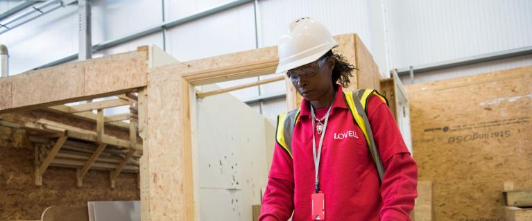 Woman working on wood at Skills Strategy Construction Academy launch event