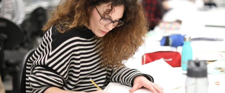 Woman writing at a desk