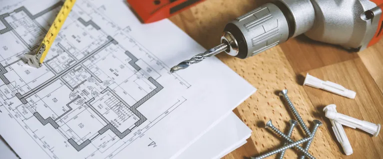 Floor plan and tools on table