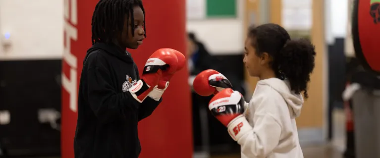 two children with boxing gloves on