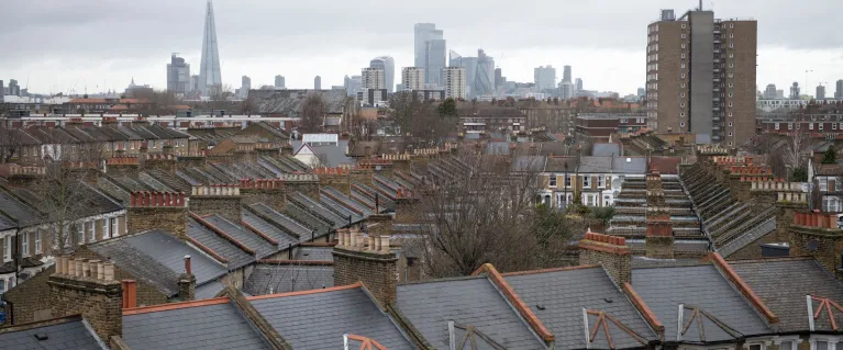 Photo of roofs in Peckham with London skyline in background