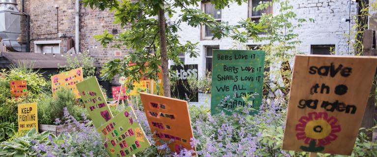 A biodiverse garden with signs