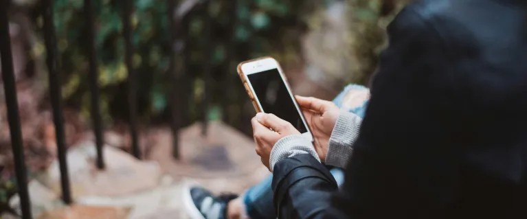 A woman texting on a mobile phone 