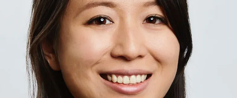 Portrait of Yoyu Li, who smiles brightly at the camera