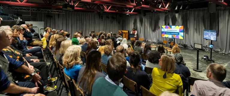 Audience in a theatre listening to presentation