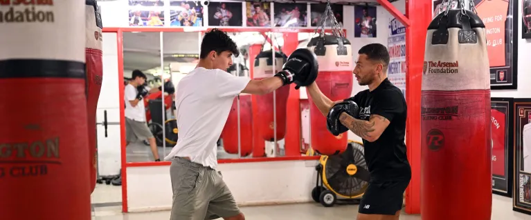 Two people boxing in gym