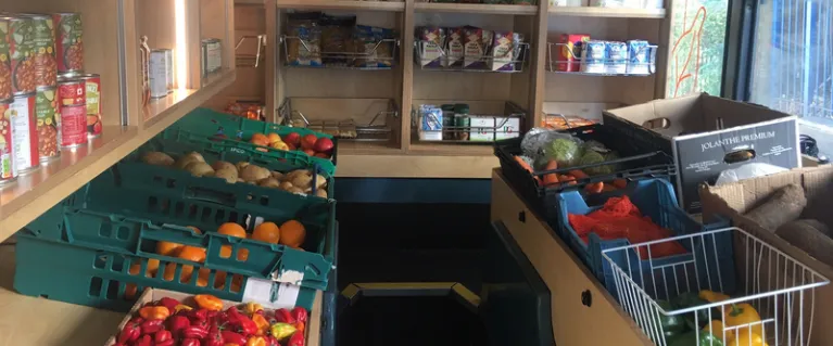 Food bus interior displaying fruits and vegetables