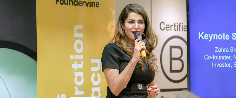 Zahra Shah, an AI and Frontier Tech expert addressing demo day attendees