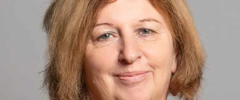 Headshot photo of Karen Buck smiling