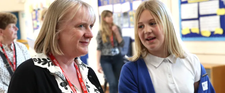 Deputy Mayor for Children and Families speaking to a student