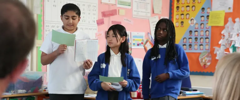 3 students presenting about their school's work as part of the Healthy Schools London award