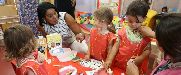 Children engaging in a supervised toothbrush programme