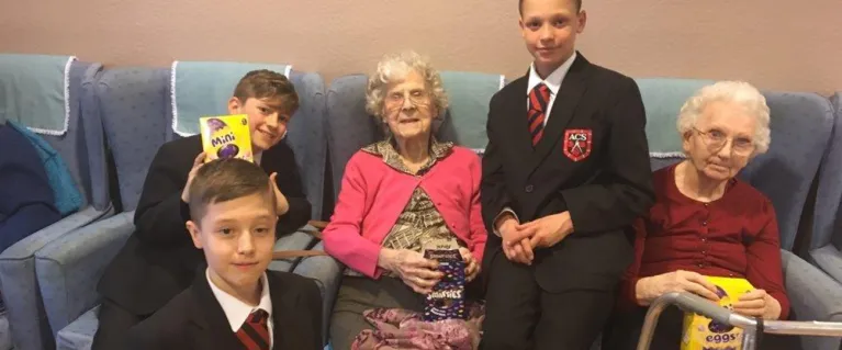 Boys from Abbotsfield School with residents of a care home