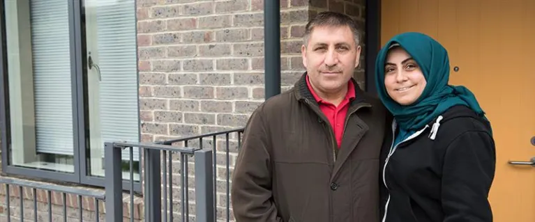 Couple outside a council house