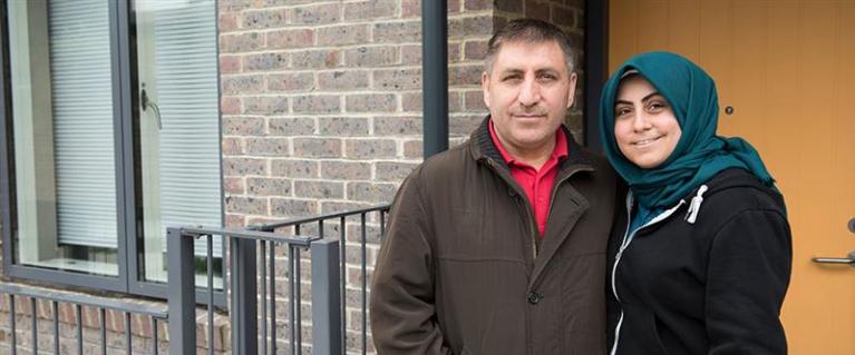 Couple outside a council house