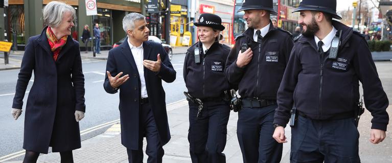 Mayor Sadiq Khan walks with Deputy Mayor Sophie Linden and police constables