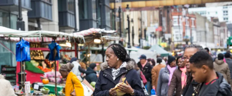 a woman shops at lower marsh street market