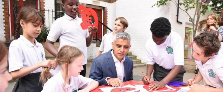 Sadiq Khan visits a primary school and sits down with children to work