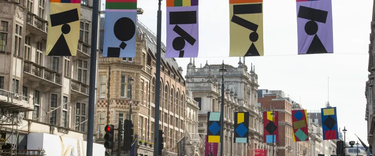 Art flags on display hung above oxford street in London