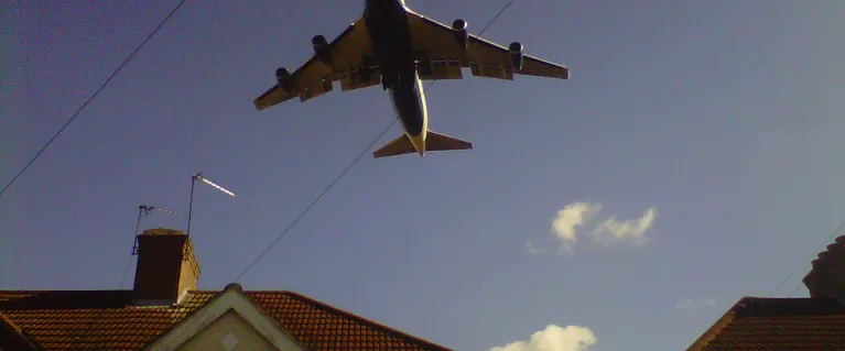 Plane over houses