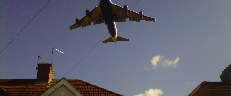 Plane over houses