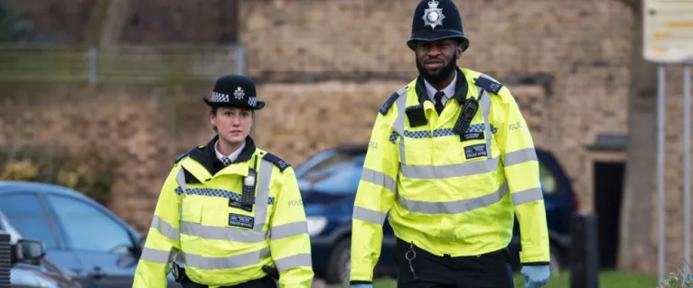 Police officers walking on the street