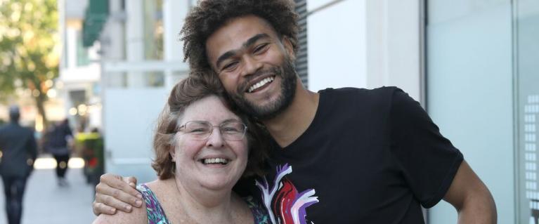 Young man hugging woman