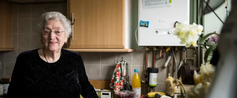 Silvia at home in the kitchen with her boiler