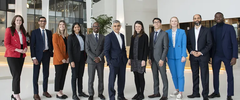 The Mayor of London standing with the official Mayor's Young Professional Panel