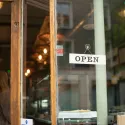 Shop door with an OPEN sign