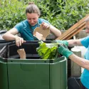 Two people recycling food