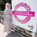 Deputy Mayor for Culture Justine Simons with a London Borough of Culture TFL rondel 