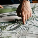 OPDC map a person hand is pointing on the map