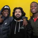 3 young people smiling at the camera