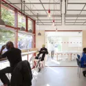 The East Street Library project. A bright room with people working while reading and at laptops and computers. Image credit: We Made That