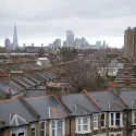 Photo of roofs in Peckham with London skyline in background