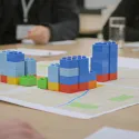 Buildings built with lego building blocks on a table
