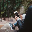 A woman texting on a mobile phone 