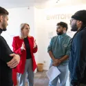 London VRU Director standing with three young people
